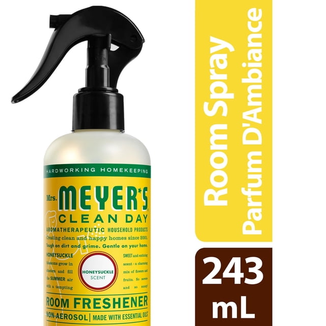 Mrs. Meyer’s Clean Day Room Freshener Honeysuckle in a 243 mL non-aerosol spray bottle with black trigger top and yellow label, featuring a garden-inspired honeysuckle scent made with essential oils to quickly freshen household air.