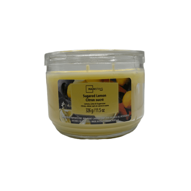MAINSTAYS PL Sugared Lemon Scented 3-Wick Glass Jar Candle, 11.5 oz, front view of a clear glass jar with pale yellow wax and three wicks. The label shows the Mainstays logo, product name in English and French, and images of lemons and limes, highlighting its lemon, lime, and sugarcane scent ideal for home décor and seasonal fragrance. Suitable for creating a relaxing atmosphere in living spaces.