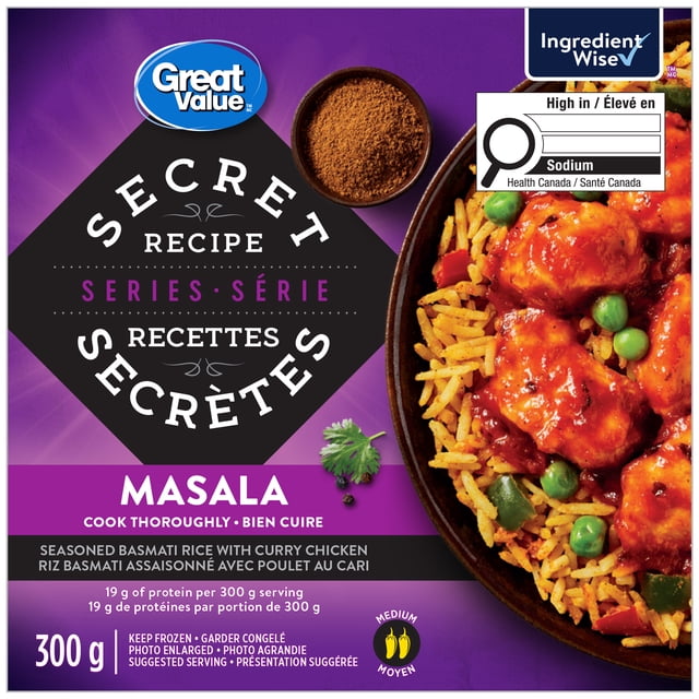 Great Value Secret Recipe Series Masala Bowl with seasoned basmati rice, curry chicken, green peas, and red peppers in a black bowl on a purple background, containing 19 g protein per 300 g serving and medium spice level, suitable for a quick frozen meal.