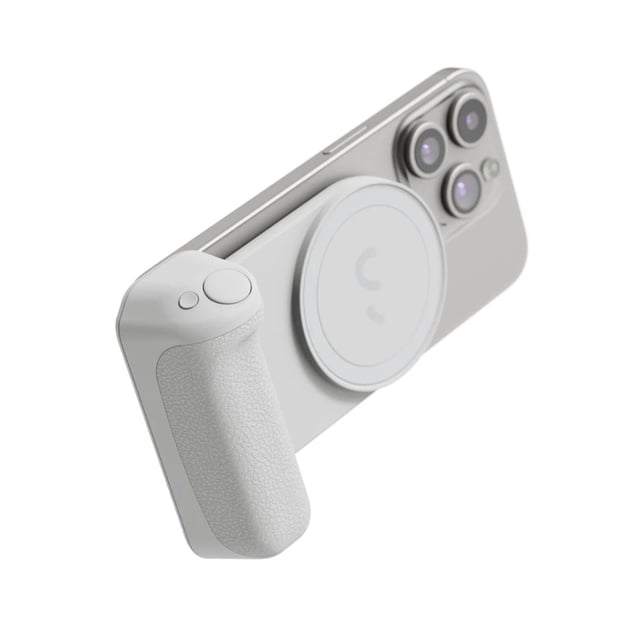ShiftCam SnapGrip Magnetic Smartphone Battery Grip in stone grey attached to a silver smartphone, featuring a textured ergonomic camera-style grip with wireless shutter button and built-in Qi-compatible 3,200mAh wireless power bank, ideal for improving mobile photography and videography and suitable for use in portrait, landscape, and dock modes.