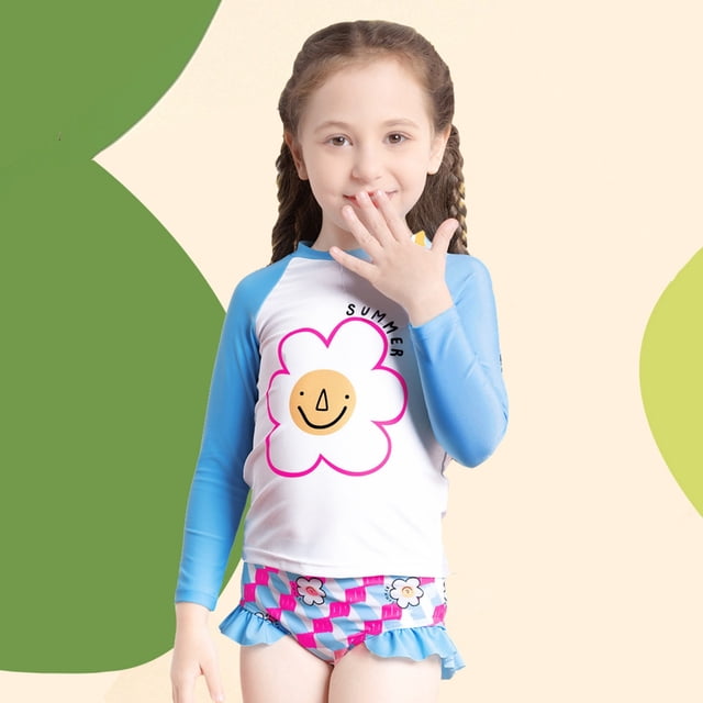 Kid Girl Rash Guard Swimwear Ruffle Long Sleeve Sun Protection Girls Toddler Bathing Suit for ages 6-7 years. The two-piece swimsuit features a white and blue long-sleeve top with a cheerful flower graphic and the word 'Summer,' paired with matching ruffle-trimmed bottoms in a pink and blue checkered pattern with floral accents. Made of lightweight, quick-drying polyester, this swimwear offers sun protection and is ideal for beach outings, pool parties, or summer vacations.