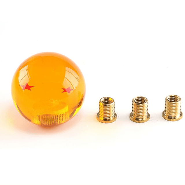 Dragon Ball Manual Gear Stick Shift Knob Universal Gear Shifter Knobs with Adapter Fits Most Car. The knob features a transparent amber acrylic design with embedded red stars, smooth to the touch, and scratch-resistant. Includes three metal thread adapters (M8x1.25, M10x1.25, M10x1.5) for compatibility with most manual and gated automatic transmissions. Suitable for car models like Toyota, Honda, Mazda, and more.