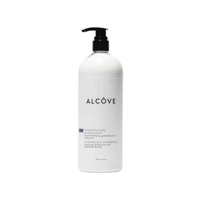Alcove Moisturizing Shampoo (950ml) by Oligo Professionnel, featuring Microcapsule Technology with sunflower oil and acai berry extracts for intense hydration and conditioning. The white bottle with a black pump dispenser is labeled in both English and French, suitable for prolonging hair color.