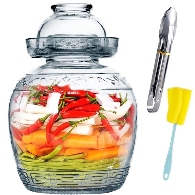 Pickling Jar, Sealed Fermenting Jar Glass with Water Seal Airlock Lid, featuring clear glass construction and 88oz capacity. The jar is filled with vibrant vegetables such as red chili peppers, carrots, and green beans, suitable for pickling kimchi, sauerkraut, or other fermented foods. Included tools are stainless steel tongs and a yellow cleaning brush with a blue handle, enhancing usability. This traditional Chinese fermentation crock is perfect for homemade food preservation.