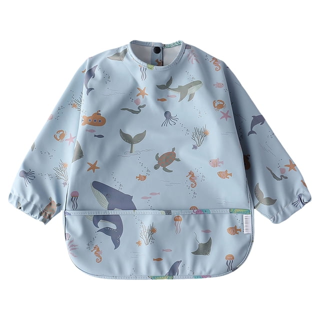 MIASHUI Baby Long Sleeve Bib Cartoon Print Toddlers Soft Bib Outfit featuring a light blue base with vibrant ocean-themed illustrations, such as whales, turtles, and starfish. The bib has long sleeves with elastic cuffs for full coverage and a front pocket to catch spills. Made from soft, breathable material, it is suitable for babies aged 6 months to 4 years, perfect for mealtime or messy activities.