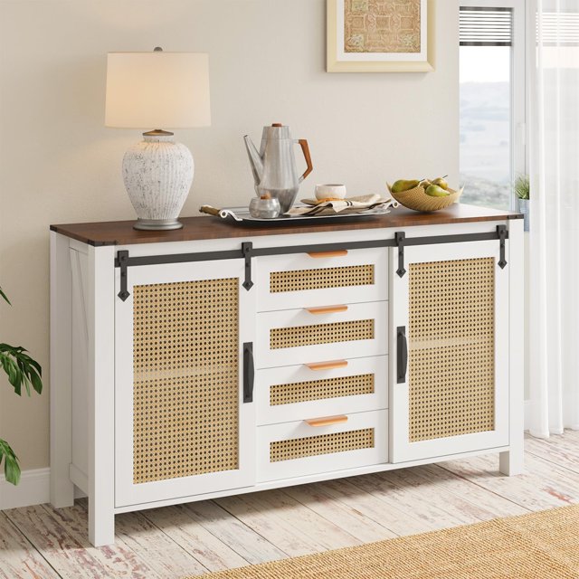 AECOJOY 55'' Rattan Sideboard Buffet Cabinet in cream white, featuring 4 deep drawers and 2 sliding rattan doors with a natural boho design. Made from natural rattan and engineered wood, it offers spacious storage for kitchenware, linens, or electronics. The cabinet is shown in a bright dining room setting with a decorative lamp, tray, and fruit bowl on its durable top surface.