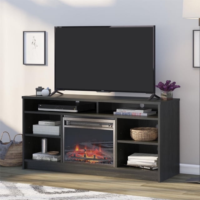 Ameriwood Home Hendrix 55-inch black oak TV stand featuring an electric fireplace insert and six shelves with books, a basket, and decor.