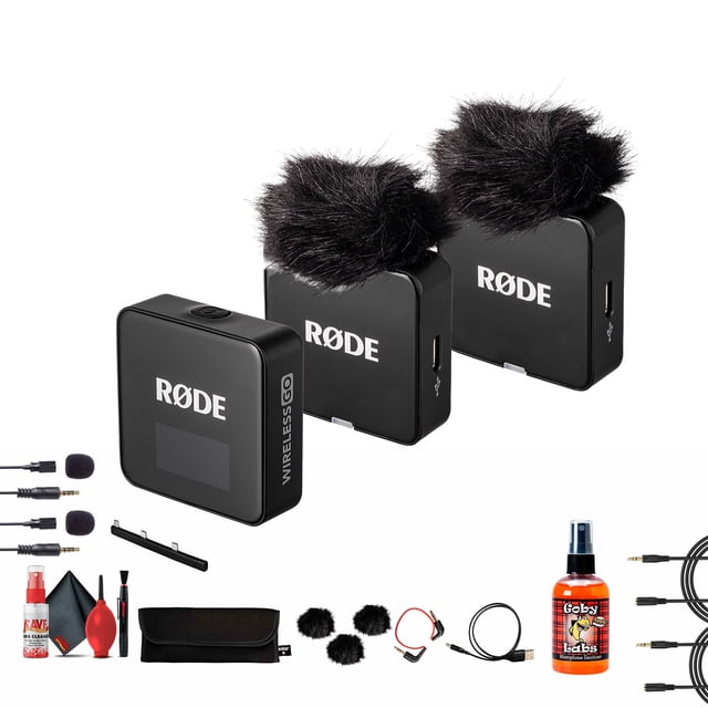 Rode Wireless GO III Dual Channel Mic System featuring two black clip-on transmitters with furry windshields, a dual-channel receiver, and various accessories including two lavalier condenser microphones, 3.5mm stereo plugs, a microphone cleaner, and a microfiber cleaning cloth. Designed for cameras, smartphones, and lavalier use, this compact wireless microphone system offers professional-grade audio with Series IV 2.4 GHz digital transmission, 32GB storage per transmitter, and intelligent GainAssist technology. Accessories include USB-C cables, a charging hub, and a carry pouch.