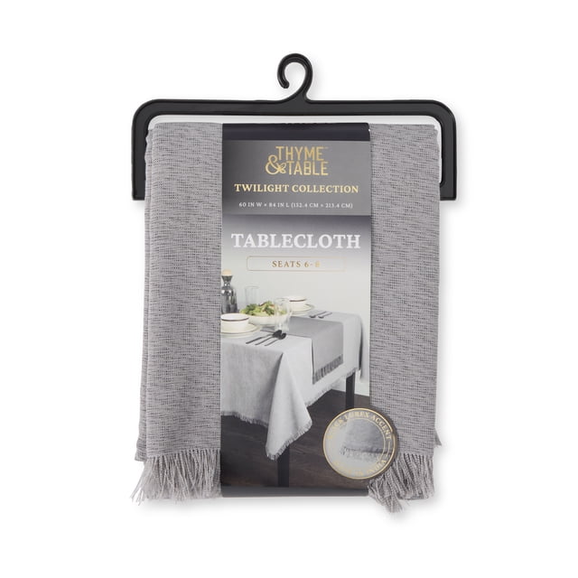 Thyme & Table 84" Rectangle Tablecloth, Gray Lurex front-facing view of rectangular gray lurex tablecloth with gold leaf pattern draped over a 60" W x 84" L table, straight hem and soft tabletop folds; neutral studio dining background, suitable for seating 8–10 people and often used to protect tables or dress buffet surfaces.