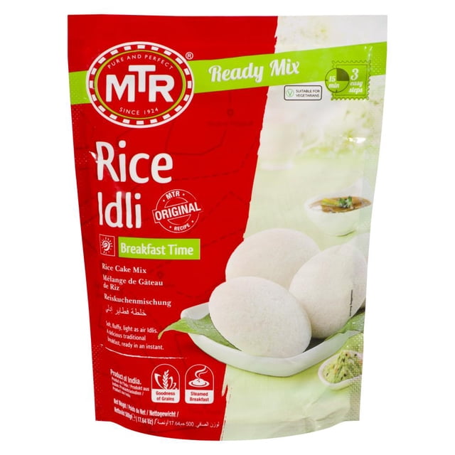 MTR Mélange pour idlis de Riz 500 Grammes avec Marquage Rouge et Vert, Présentant le logo MTR et Étiqueté comme Mélange Prêt à Recette Originale pour Préparer Rapidement des idlis de Riz Douces, Moelleuses et Authentiques de South Indian. Convient aux Végétariens, Ce Mélange Instantané Offre une option Pratique de Déjeuner Vapeur et Est Idéal pour l'Heure du Déjeuner.