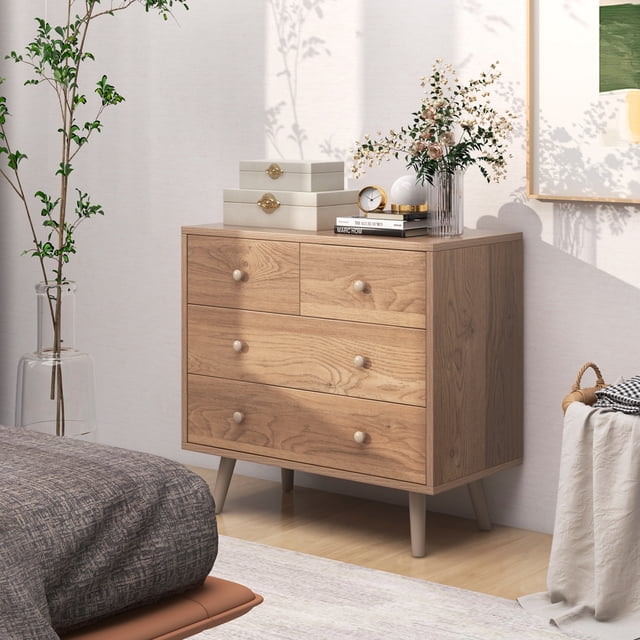 Giantex Storage Cabinet with 4 storage drawers in a natural wood finish, featuring two small drawers on top and two large drawers below. The cabinet includes an anti-tipping device for enhanced safety and stability. It is shown in a modern bedroom setting, styled with decorative items like a vase, books, and a clock on its spacious top. The cabinet has round metal knobs, non-slip foot pads, and a sleek design, making it suitable for living rooms, entryways, or other spaces.