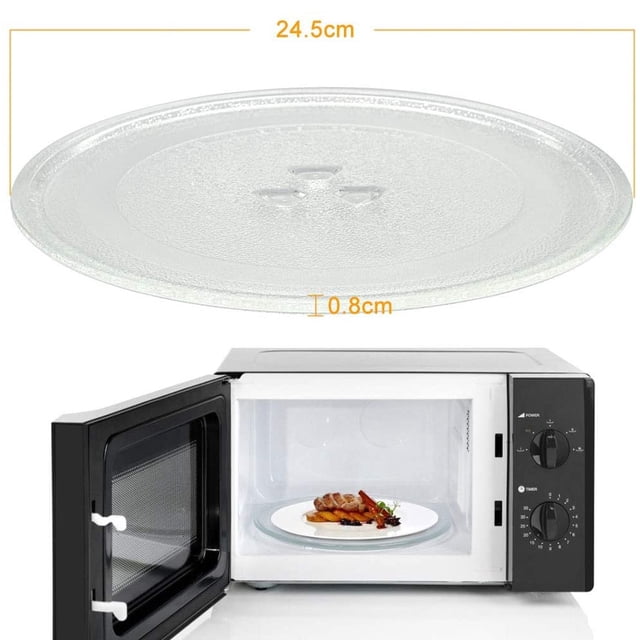 Assiette de Micro-Ondes de Rechange, Plat de Micro-Ondes Durable Universel, Plateau Tournant pour Micro-Ondes, Assiette en Verre Ronde de Rechange. la Plaque en Verre Transparente Mesure 245 mm de Diamètre et Présente un Fond en Forme de Y avec Trois Petits Picots pour un placement Sécurisé sur le support Central du Micro-Ondes. la Conception à Bord Circulaire Comprend un Bord Surélevé pour Empêcher les Aliments de Glisser pendant la rotation. Montré avec un Gros Plan de la Plaque et un Micro-Ondes Ouvert Contenant une Plaque Similaire avec des Aliments Dessus.