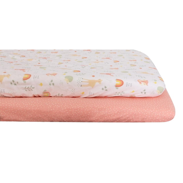 George Baby 2-Pack Mini Fitted Crib Sheets with one sheet featuring pastel animal and rainbow prints on white and the other coral pink with white polka dots, made of soft cotton to fit standard mini crib mattresses for nursery comfort.