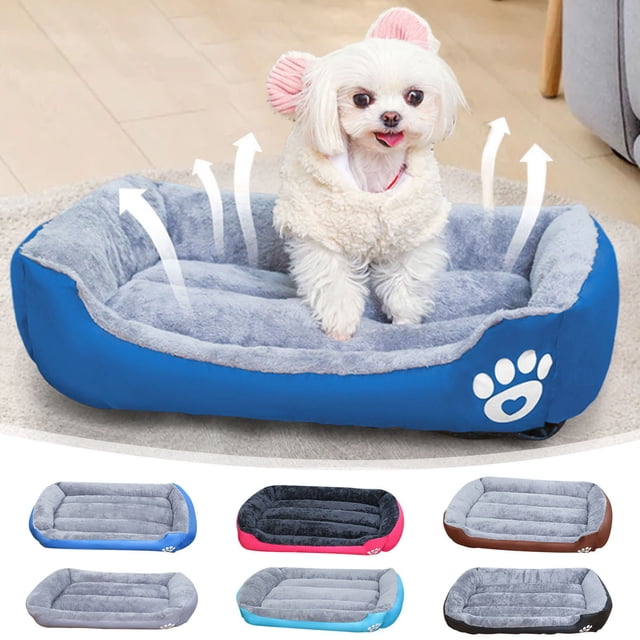 Vaidha Dog Beds For Medium Dogs Washable Dog Bed, an orthopedic pet bed with a rectangular design and raised rims for head and neck support. The bed is shown in blue with a paw print logo, made of soft, breathable fabric and filled with fiber for warmth and comfort. A small dog is sitting on the bed in a cozy indoor setting. Additional color options include gray, pink, and brown.