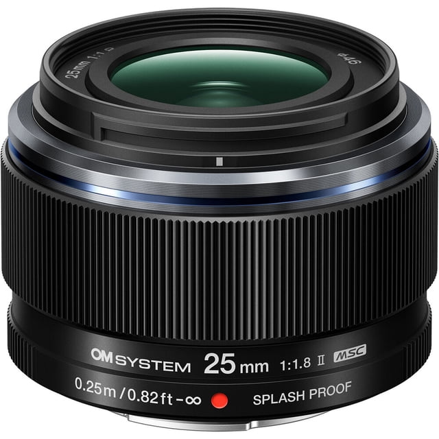 OM SYSTEM M.Zuiko Digital 25mm f/1.8 II Lens shown in a close-up front view with a black ribbed focus ring, blue accent ring, and white text indicating 25mm focal length, f/1.8 aperture, MSC autofocus, splash-proof design, and minimum focus distance of 0.25m (0.82ft), suitable for capturing sharp images with soft background bokeh.
