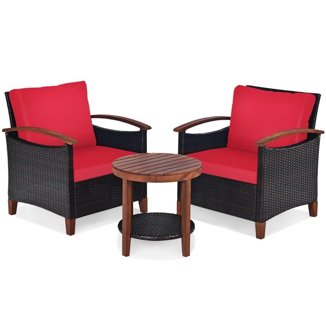 Giantex 3 Pieces Patio Furniture Set featuring two rattan chairs with red cushions and acacia wood armrests, paired with a round acacia wood side table with a lower rattan shelf. The chairs have wide armrests, backrests, and thick cushions for comfort. The set is weather-resistant and suitable for outdoor use in gardens, balconies, or backyards.