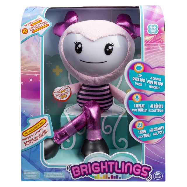 Brightlings Peluche Interactive Chantante Rose Parlante de 15 Pouces en Emballage, Montrant un Personnage en Peluche Rose au Visage Lisse, des Nœuds Métalliques Violets sur la Tête et les Jambes, un Torse Rayé Noir et Rose, et des Pieds Noirs, Conçu pour les Enfants de 4+ Ans avec des Fonctionnalités Interactives Incluant l'Enregistrement de la Voix, la Répétition de phrases et le Chant de six styles de Musique.