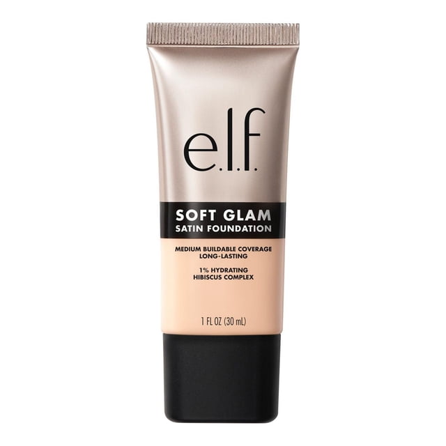 e.l.f. Cosmetics Soft Glam Satin Foundation in a 30 ml beige tube with a matte taupe cap, offering medium buildable coverage and a long-lasting, breathable formula infused with 1% hydrating hibiscus complex for a smooth satin finish, suitable for dry, oily, and combination skin.