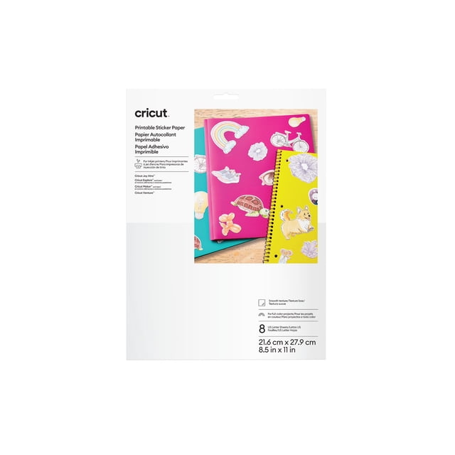 Cricut® Printable Sticker Paper (8 ct), white 8.5 in x 11 in sheets shown with colorful notebooks decorated with printed stickers including a rainbow, bicycle, turtle, dog, and light bulb, designed for inkjet printers and compatible with Cricut cutting machines, suitable for scrapbooking and paper crafts.