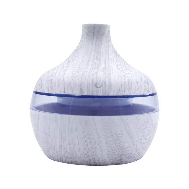 Essential Oils for Diffusers Aromatherapy New Portable Air Aroma Essential Oil Diffuser with a compact, rounded design featuring a white wood grain finish and a translucent blue band. This USB-powered diffuser has a 300ml water capacity and includes a 7-color LED night light for creating a relaxing ambiance. Suitable for humidifying air, refreshing skin, and relieving stress with aromatherapy. Includes a USB data cable.