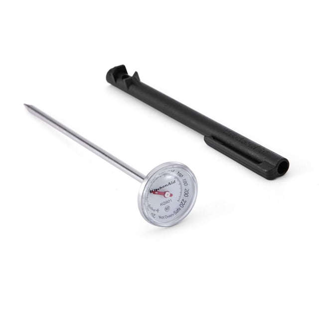 KitchenAid 1" Thermometer with Sleeve featuring a stainless steel probe and a 1-inch dial with a magnified convex plastic lens displaying temperatures from 20 to 220 degrees Fahrenheit, paired with a black protective sleeve that stores the thermometer and houses a calibration wrench, also serving as an extended handle for ease of use.