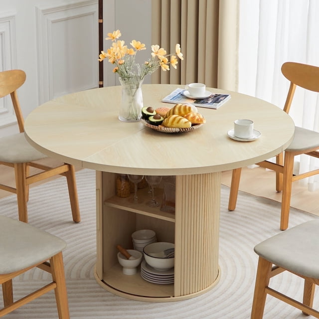 Wirrytor Round Dining Room Table with Storage, a 47-inch natural wood grain kitchen table designed for 4-6 people. It features a sturdy barrel column base with 15mm wooden strips and integrated two-layer storage shelves for dining essentials. The round metal leg in the center adds an industrial touch, while the textured finish complements various home decor styles. Ideal for dining rooms or breakfast nooks.
