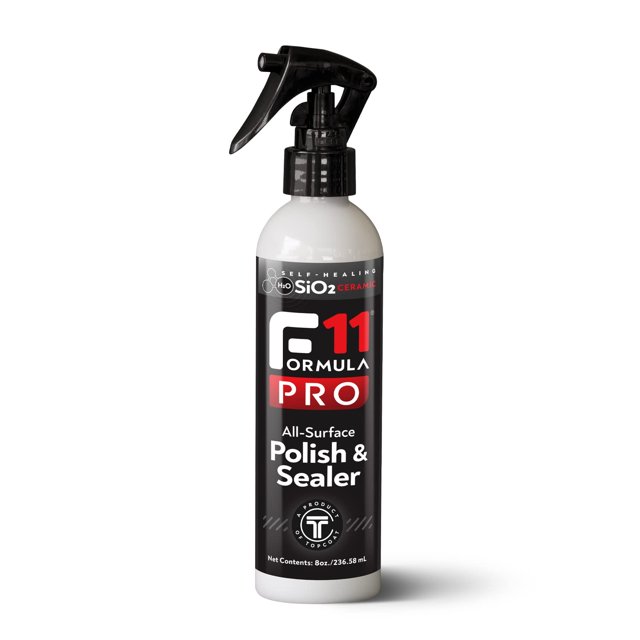 TopCoat F11PRO All-Surface Polish & Sealer 8 oz spray bottle, a water-based ceramic coating designed for cars, motorcycles, boats, and RVs. The bottle features a black label with red and white text, highlighting its advanced formula and hydrophobic properties. The spray nozzle is black, providing easy application for cleaning, restoring, and protecting surfaces. Suitable for both interior and exterior use, it forms a durable, non-abrasive protective barrier.