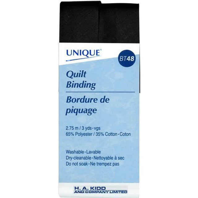 UNIQUE Quilt Binding in stone blue, 25mm wide and 2.75m long, made from a 65% polyester and 35% cotton blend. The pre-folded binding is folded flat with a blue and white label showing care instructions including washable, dry-cleanable, and do not soak. Ideal for finishing raw edges on quilts and fabric projects, also suitable for craft and home décor sewing.