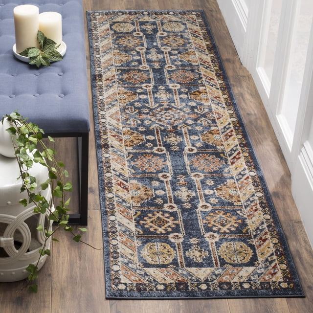 SAFAVIEH Bijar Pavel Traditional Area Rug runner featuring Kurdish-inspired geometric patterns in rich earth tones and vibrant blue highlights, displayed on hardwood flooring beside a blue tufted bench and white ceramic planter with trailing green plant, suitable for enhancing classic and urban-chic home décor.