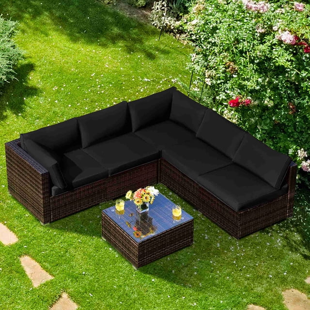 Costway 6PCS Patio Rattan Furniture Set Cushioned Sofa Coffee Table Black, featuring a modular design with 2 armless sofas, 2 corner sofas, and a coffee table. The set is crafted with a sturdy steel frame and premium PE wicker in a mix brown finish, paired with black cushions for a modern look. The coffee table includes a tempered glass top for durability and easy cleaning. Ideal for outdoor spaces like patios, gardens, or balconies, this set offers ergonomic backrests, thick cushions with removable covers, and aluminum foot pads to prevent floor scratches. Dimensions include 30'' x 30'' x 25'' for corner sofas, 26'' x 30'' x 25'' for armless sofas, and 26'' x 26'' x 13'' for the coffee table.