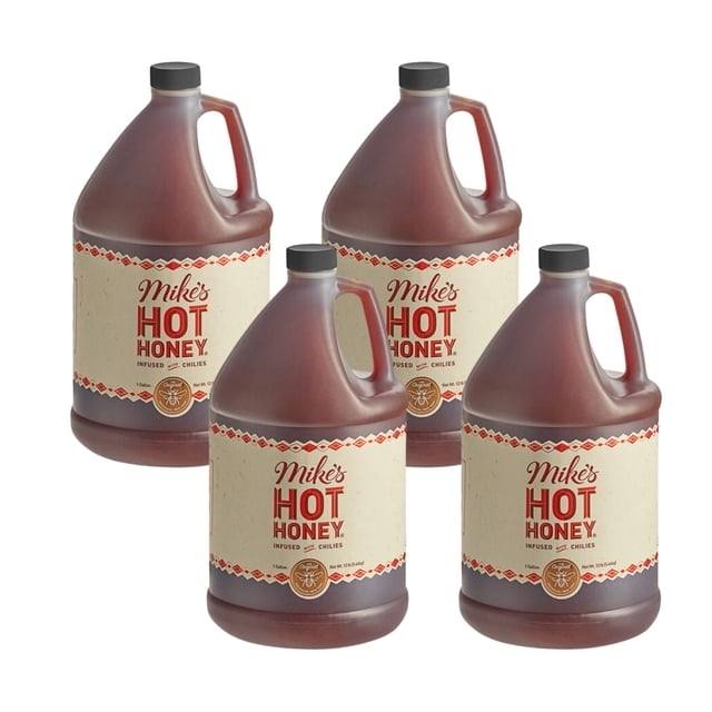Mike's Hot Honey Original Bulk Food Service 12 lbs, featuring four 12 lb jugs of chili-infused honey with beige labels displaying the brand name and product details. Each jug includes a sturdy handle and black cap, ideal for restaurants, catering, and bulk food service needs.