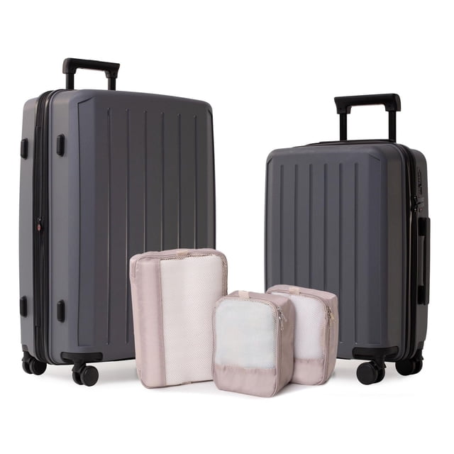 5-Piece Hardside Luggage Set including a 28-inch expandable spinner suitcase and 20-inch carry-on spinner suitcase in matte dark grey polypropylene, with three beige packing cubes featuring mesh panels for organized travel packing.