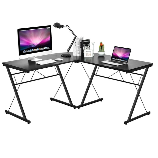Gymax 59'' L-Shaped Corner Desk Home Office Computer Table Study Workstation in black, designed with a spacious L-shaped layout to maximize corner space. Constructed from durable P2 MDF and powder-coated iron pipes, it features X-shaped brackets for stability and adjustable foot pads for balance. Ideal for use as a computer desk, study workstation, or gaming desk, it offers ample workspace for laptops, books, and office supplies, fitting seamlessly into home or office decor.