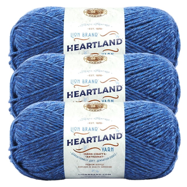 Lion Brand Yarn Heartland Yarn 3Pack featuring three skeins of medium worsted weight acrylic yarn in heathered blue, each with a white label displaying brand and product details, suitable for knitting, crochet, and durable craft projects.