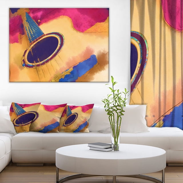 Design Art Listen to The Colorful Music Canvas Print depicting an abstract close-up of an acoustic guitar in vibrant pink, blue, and beige tones, gallery wrapped on a 1-inch wood frame, ready to hang above a white sofa with matching guitar-themed cushions in a modern living room. This canvas print is also suitable for adding a musical artistic touch to office spaces.