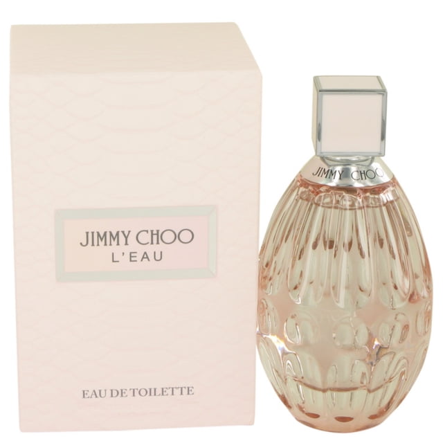 Jimmy Choo L'eau By Jimmy Choo Eau De Toilette Spray 3 oz, a women's perfume featuring a fresh fruity floral fragrance. The image shows a 3 oz bottle with a textured, blush pink glass design and a silver cap, placed next to its matching light pink box with subtle snake-skin patterns and the Jimmy Choo L'eau branding.