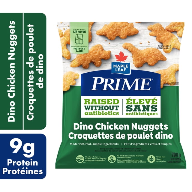 Prime Nuggets de Poulet Panés Dino dans un Sac Refermable Vert et Blanc de 700 g Présentant des Nuggets de Poulet Panés en Forme de Dinosaure Faits avec du Poulet Nourri aux Grains Élevé Sans Antibiotiques, Sans Colorants Ni Agents de Conservation Artificiels, Compatible Friteuse à air Chaud, avec 9 g de Protéines par Portion.