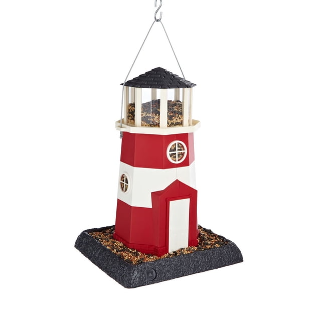 North States Large Lighthouse Birdfeeder shaped like a red and white miniature lighthouse with a black roof and clear plastic window panes in the lantern room holding 8 lbs of seed, featuring a removable tray perch filled with seed and a metal hook for hanging or pole mounting.
