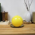 thumbnail image 2 of Bougie en forme de boule jaune haute brillance, non parfumée, 2 of 5