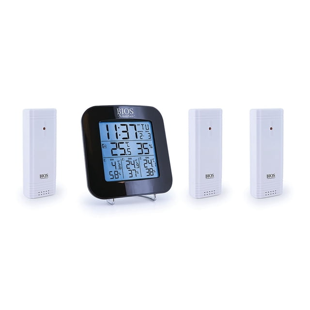 Digital indoor/outdoor thermometer w 3 sensors with black square LCD showing time, date, indoor temperature and humidity, plus outdoor temperature and humidity from three white wireless sensors, suitable for monitoring multiple outdoor living areas.