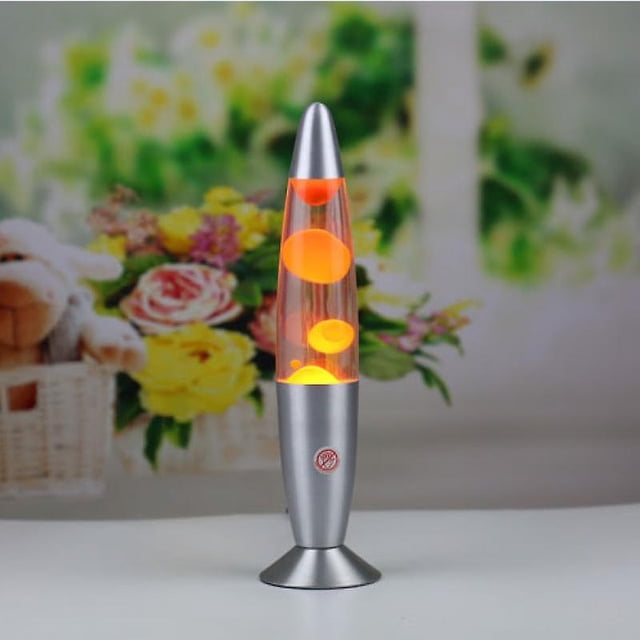 Orange Futuristic Lava Lamp With Switch by WANAN, featuring a retro-style design with vivid orange lava globules floating in a clear liquid. The lamp has a sleek silver base and top, creating a modern aesthetic. Ideal for mood lighting in living rooms, bedrooms, or children's rooms. Positioned on a white surface with a blurred floral background.