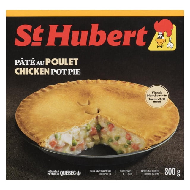 St. Hubert Frozen Chicken Pot Pie with golden-brown crust and a slice removed to show tender white meat chicken, carrots, green peas, and mushrooms in creamy béchamel sauce, 800 g package prepared in Québec, high in protein and vitamin A.