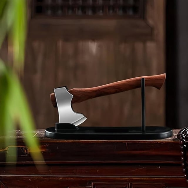 Mini Camping Survival Axe for Outdoor Activities and Home Collection, featuring a compact and durable hand hatchet with a sleek silver blade and ergonomic wooden handle. Displayed on a black stand, this versatile tool is ideal for camping, fishing, and bushcraft. Its stylish design makes it a practical gift for outdoor enthusiasts and collectors.