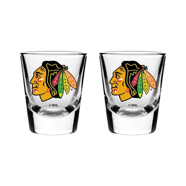 OFFICIALLY LICENSED NHL 2OZ SHOT GLASS SET CHICAGO BLACKHAWKS with two clear 2-ounce shot glasses featuring a solid base and the Chicago Blackhawks logo in team colors, dishwasher safe and suitable for home bar entertaining.