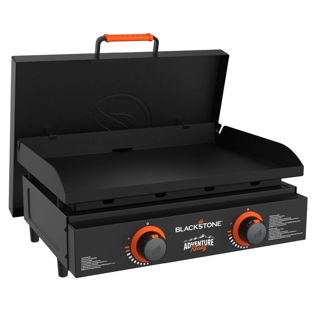 Blackstone Adventure Ready Outdoor Griddle, 2-burner 22" propane flat top grill with black finish, orange handle and control knobs, hinged lid, and rear grease management system for easy cleanup, suitable for portable outdoor cooking.