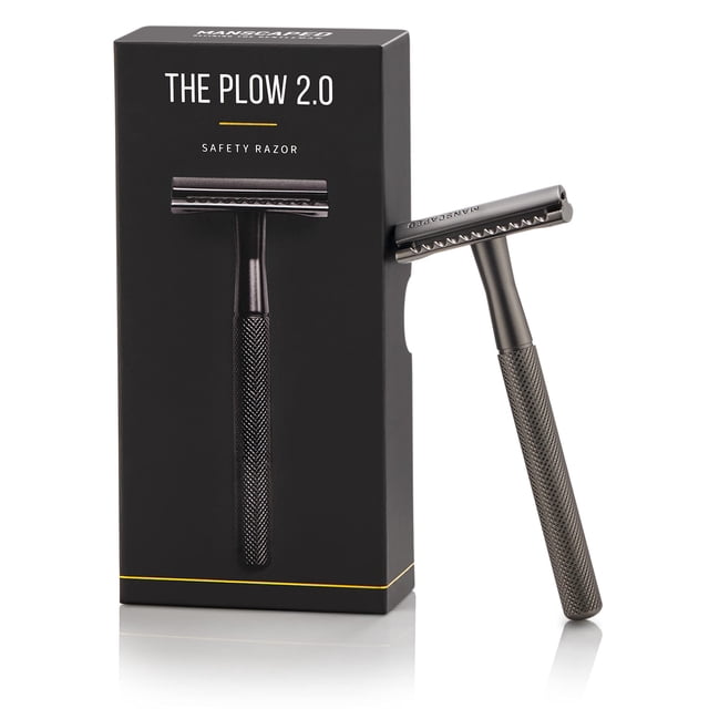 MANSCAPED® The Plow® 2.0 Men's Premium Single Blade Double-Edged Safety Face Razor in grey, designed for a close and comfortable shave. Features a brass handle and zinc alloy head with a gunmetal coating, ideal for travel grooming. Includes three additional blades, displayed next to its branded packaging.