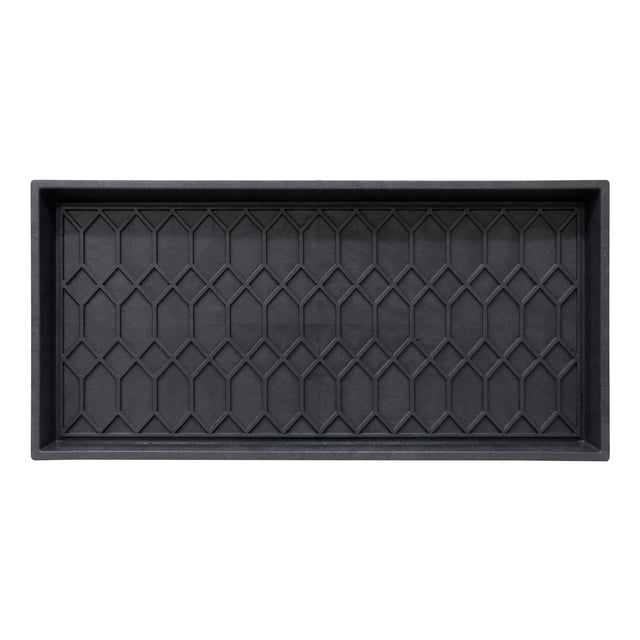 Mainstays Manor 17x35 Boot Tray, High-Walled, Waterproof Floor Protector, Geometric Black. Centered front-facing rectangular tray with molded high side walls and raised geometric pattern in matte black; 17x35 size from title, waterproof molded surface wipes clean; made in North America from 100% recycled materials; often used to hold multiple pairs of shoes or boots and suitable for mudroom, entryway or garage use.
