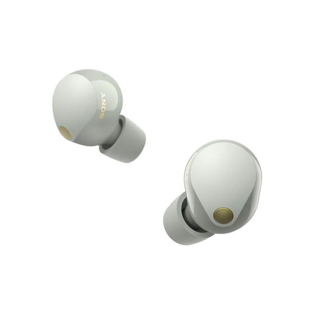 Sony WF1000XM5 True Wireless Noise Cancelling Earbuds in light grey matte finish, shown from a 3/4 angle displaying ergonomic shape and gold-tone microphone mesh, designed for stable fit and superior noise cancellation, suitable for use in noisy environments like airplanes and trains.