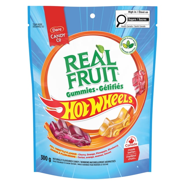 Realfruit Hot Wheels 12x300g gummies in a resealable blue pouch, featuring plant-based, naturally flavoured gummies shaped like Hot Wheels cars with cherry, orange, pineapple, and blueberry flavours, made in Canada and high in sugars.