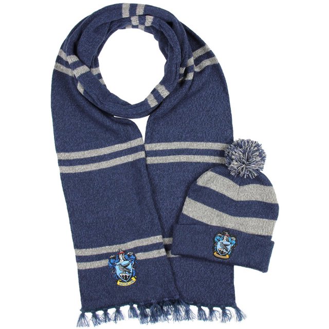 Harry Potter Hogwarts Houses Knit Scarf & Pom Beanie Set (Ravenclaw) featuring a blue and grey striped design. The scarf includes fringe detailing, and both items display the Ravenclaw crest emblem. Made from a polyester and acrylic blend, this officially licensed women's accessory set is ideal for fans and collectors.